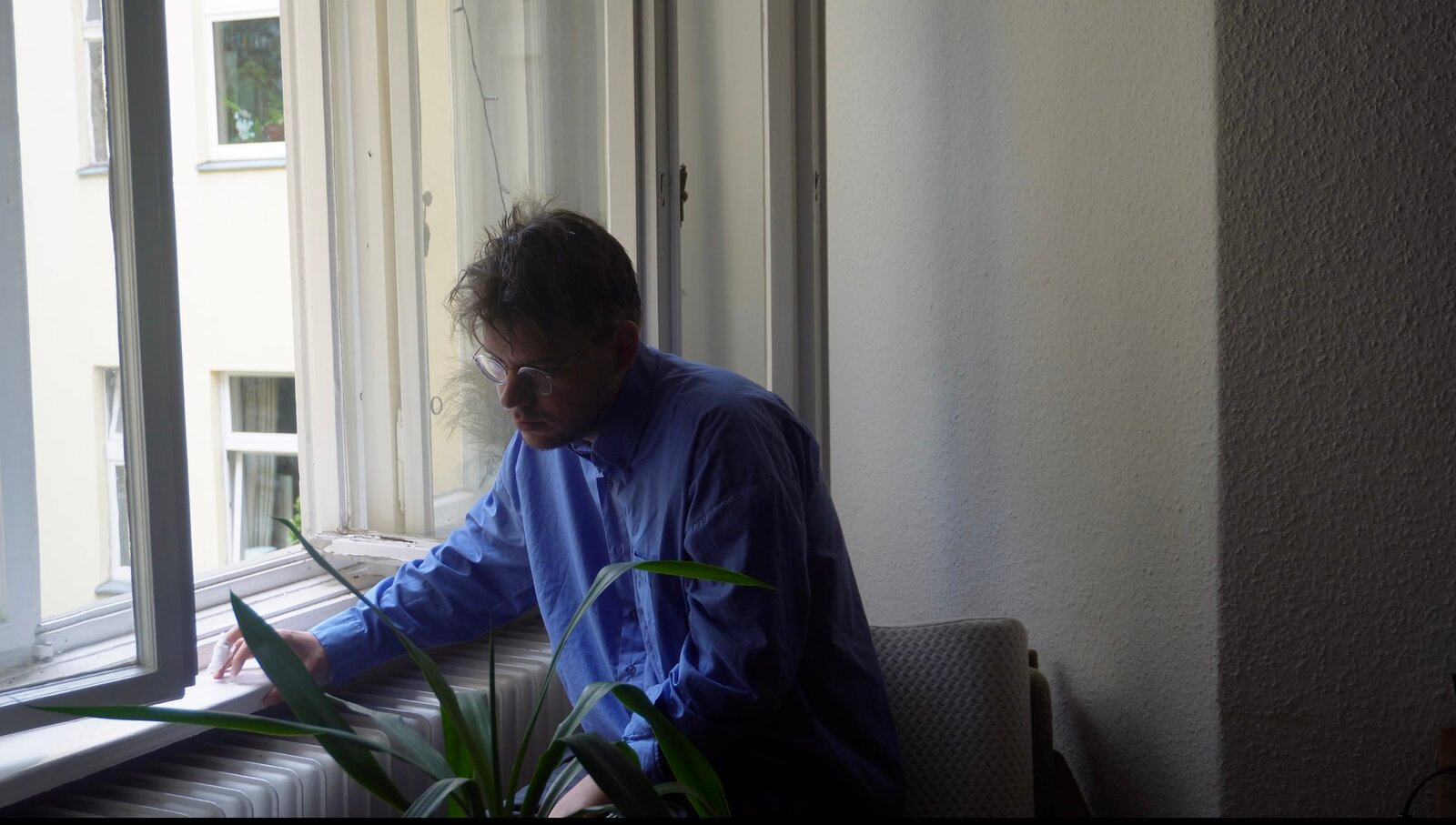 Getting Lost still — the protagonist at a Berlin apartment window